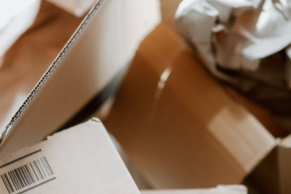 A person moving gracefully in a bright, open space, showing concentration.